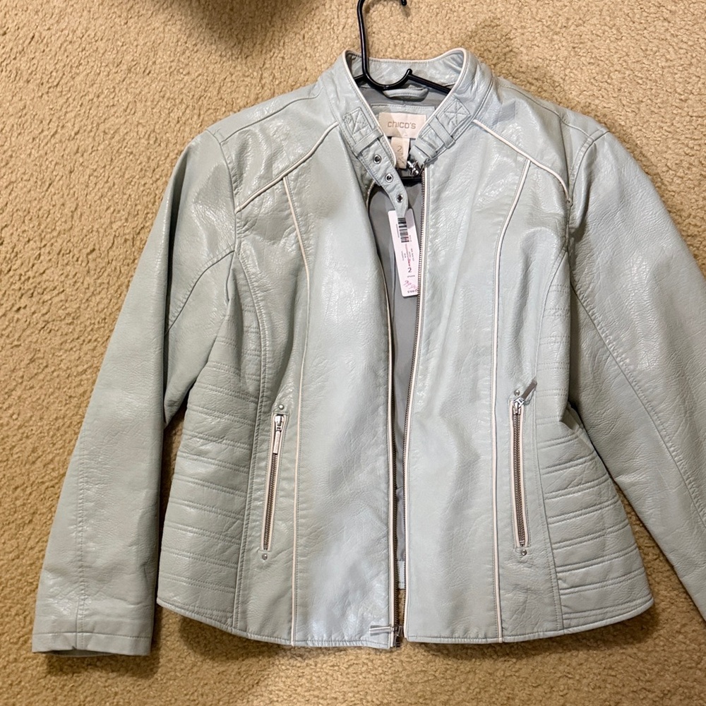 Chico's faux leather moto jacket in a pale blue color with white piping.